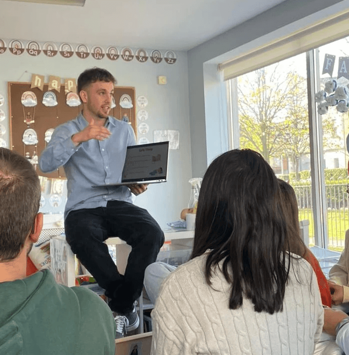 Roberto, founder of SolveED, delivering in-person training to a group of educators in a creche